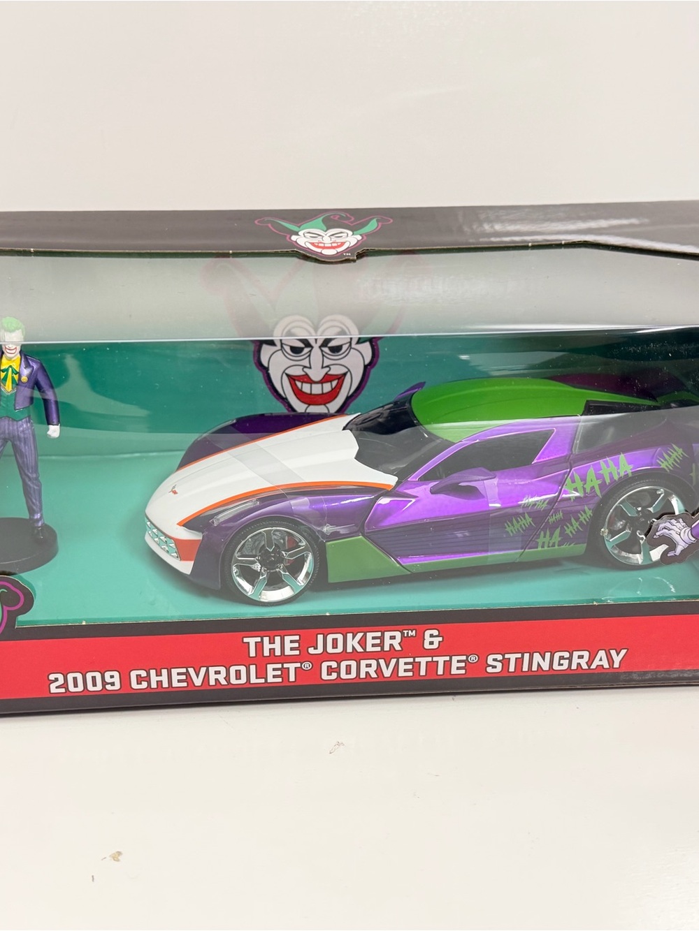 The Joker 2009 Chevrolet Corvette Stingray Toy Car - Purple/Green/White